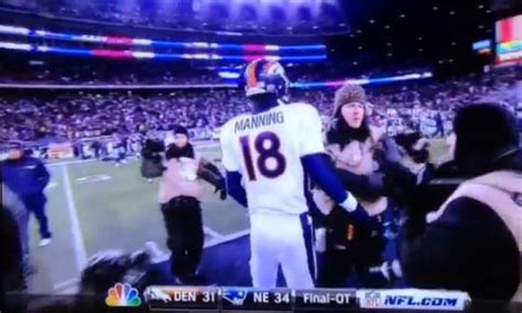 Photographers Fight While Trying To Film Manning-Brady Postgame