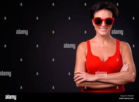 Mature Beautiful Woman With Short Hair Against Black Background Stock Photo Alamy