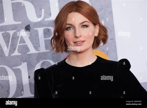 Alice Levine Poses For Photographers Upon Arrival At The Brit Awards In