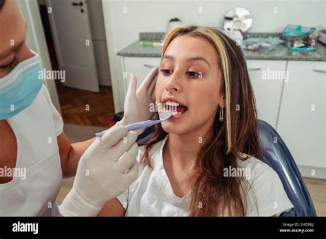 Beautiful Latina Dentist Checking A Teenage Girl S Teeth Oral Health Concept Dental Insurance