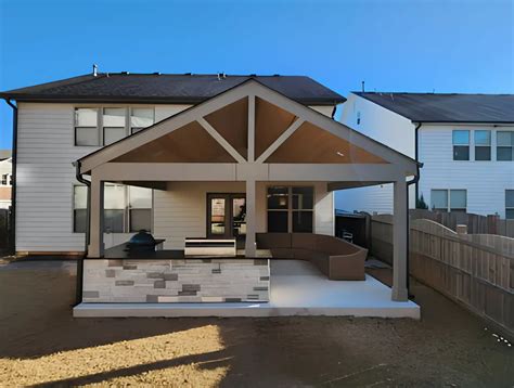 Outdoor Living Space With Kitchen And Gable Roof In Woodstock Ga