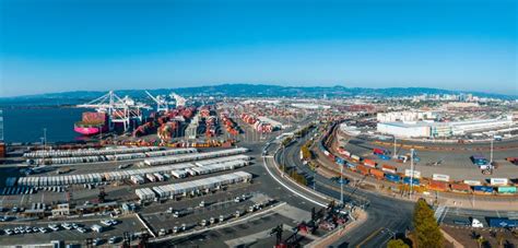 The Oakland Outer Harbor Aerial View Loaded Trucks Moving By Container