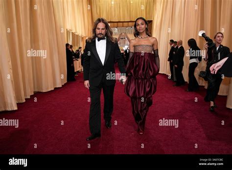 Marco Perego Saldana Left And Zoe Saldana Arrive At The Oscars On