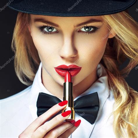 Sexy Blonde Woman With Red Lips And Nails Applying Lipstick Stock Photo By Sakkmesterke