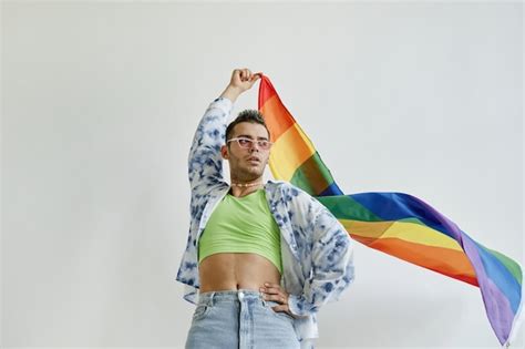 Premium Photo Low Angle Portrait Of Confident Gay Man Waving Pride