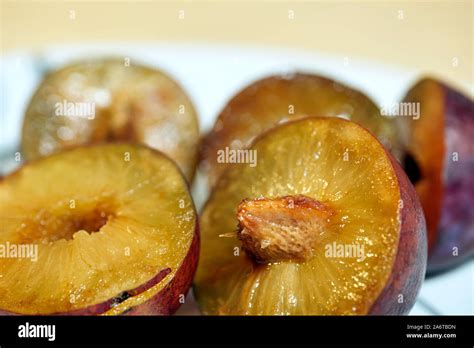 Ripe plump and juicy plums on a white background Stock Photo - Alamy