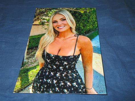 Close Up Of Pretty Blonde Model W Tan Lines Posing Showing Cleavage Photo