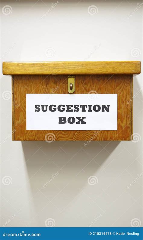 Business Concept Shot Of Wooden Suggestion Box On Wall In Office Stock