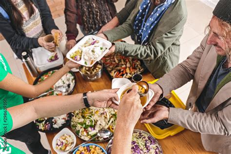 Volunteers giving food to homeless people, top view Stock Photo | Adobe Stock