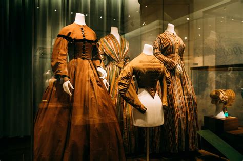 Collection Of Historical Costumes In Showcase In Museum · Free Stock Photo