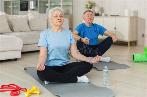 Yoga Mindfulness Meditation Senior Adult Mature Couple Practicing Yoga At Home Stock Photo