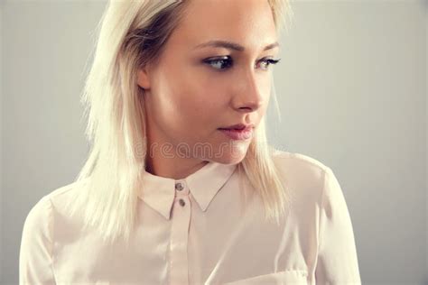 Pensive Beautiful Female Blonde Model In Shirt Looking Away From Camera Stock Photo Image Of