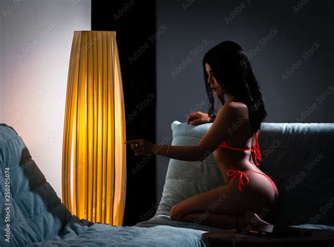 Sexy Asian Girl In Red Bikini Sitting On Sofa Stock Photo Adobe Stock