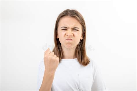 Teenager Girl Shows Fist On White Background Isolated Stock Image Image Of Isolated Brunette