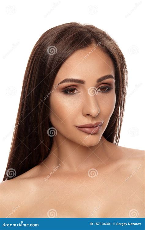Close Up Portrait Of A Brunette Nude Model Girl With Professional Evening Make Up And Plump Lips