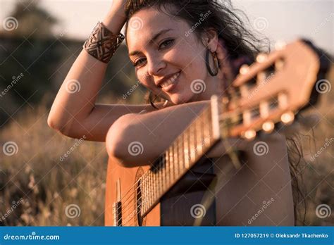 Smiling Naked Curly Brunette Girl Sitting With Guitar In The Field Stock Image Image Of Adult