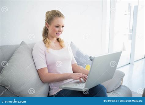 Casual Content Blonde Sitting On Couch Using Laptop Stock Photo Image Of Ethnicity Pretty