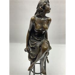 Art Deco Style Bronze Modelled As A Semi Naked Female Figure Seated Upon A Chair H Cm