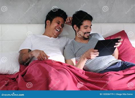 Gay Man Playing Video With Partner In Bed Stock Image Image Of Playing Lgbt 132036779
