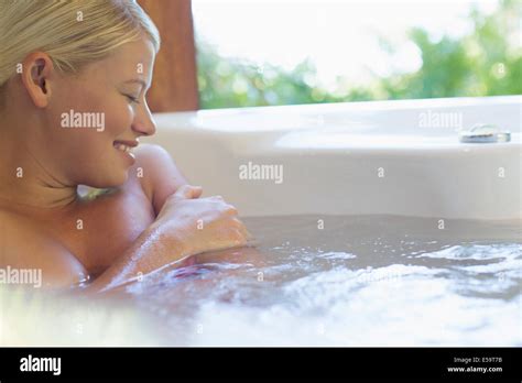 Woman Relaxing In Hot Tub Stock Photo Alamy