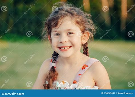 Caucasian Preschool Blonde Girl In Pink Swimsuit Standing On Wooden