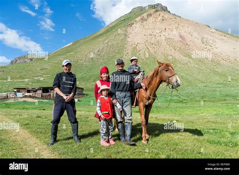 Kyrgyz family with horse, Sary Jaz valley, Issyk Kul region, Kyrgyzstan
