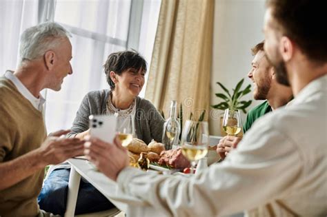 A Gay Couple Enjoys A Meal Stock Photo Image Of Warm