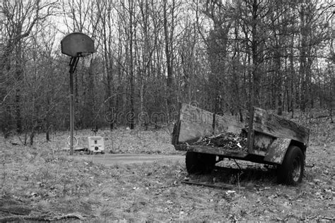 A Child S Blue Toy Dump Truck Sits Outside During The Early Spring