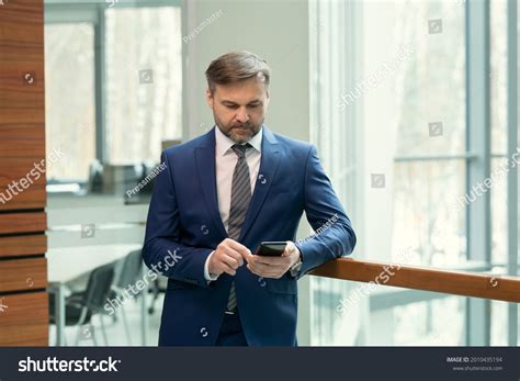 Serious Mature Businessman Suit Standing Office Stock Photo 2010435194 Shutterstock