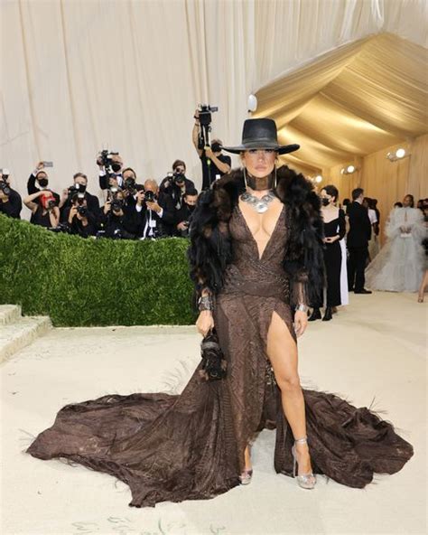 Jennifer Lopez Wears a Plunging, Feathered Ralph Lauren Gown at the ...