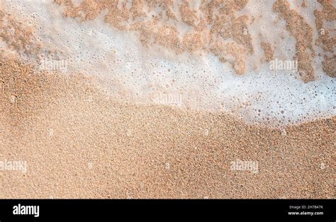 Sand Water Background Wave With Foam On The Sand Stock Photo Alamy
