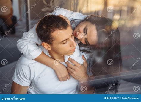 Reflection In Glass In A Mirror Hot Couple In Love Man And Woman Slowly Undress Each Other