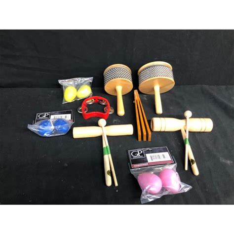 Collection Of Handheld Percussion Instruments Including A Standard And