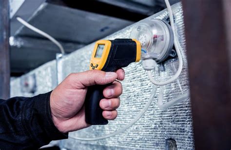 Technician Use Infrared Thermal Imaging Camera To Check Temperature at ...
