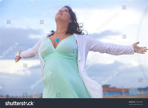 Beautiful Young Woman In Dreamy Lighting On The Beach Stock Photo