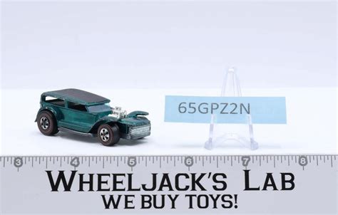 The Demon Aqua Redline Hot Wheels Mattel Vintage Rl Wheeljack S Lab