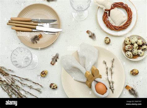 Table Setting With Easter Eggs Pussy Willow Branches And Feathers On White Background Stock