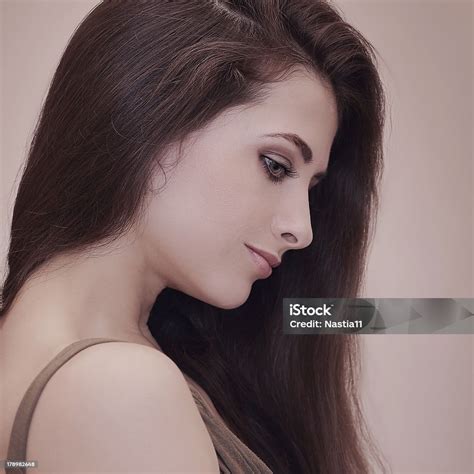 Beautiful Woman Profile With Long Hair Looking Down Stock Photo