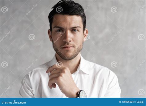 Handsome Man Wear Blue Suit Isolated On Grey Background Stock Photo