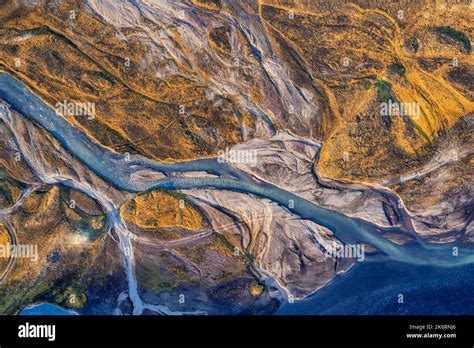 Top View Of Abstract Glacier Rivers Pattern Flowing Through Volcanic