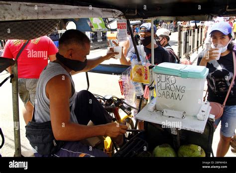 Antipolo City Philippines May 16 2020 Vendor Serves Coconut Juice In His Mobile Stall As