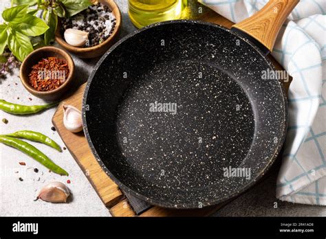 Empty Skillet Vegetables Spices And Herbs On Gray Stone Background