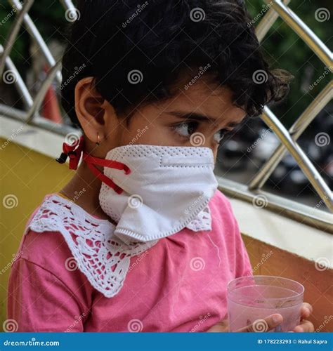 Little Girl In Medical Mask Staying At Home Under Quarantine Stock