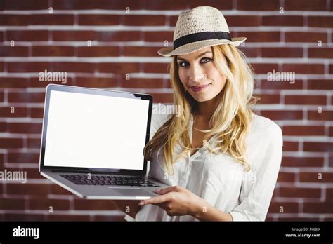 Beautiful Blonde Woman Showing Her Laptop Stock Photo Alamy