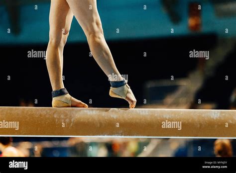 Artistic Gymnastics Legs Women Gymnast Exercises On Balance Beam Stock