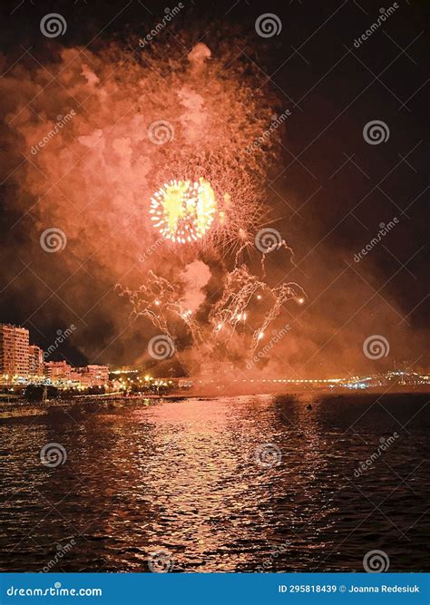 Colorful Fireworks in the Night Sky on the Seafront of Alicante Spain