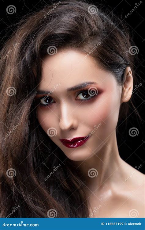 Portrait Of A Beautiful Glamorous Brunette Girl With Naked Shoulders Shimmering Makeup Red