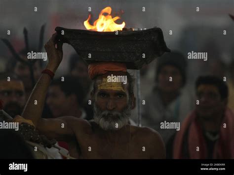 A Sadhu Or Holy Man Moves To Take A Holy Dip At Sangam Confluence Of