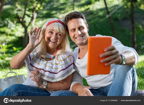Pleased Pretty Blonde Communicating Online With Pleasure Stock Photo Yacobchuk