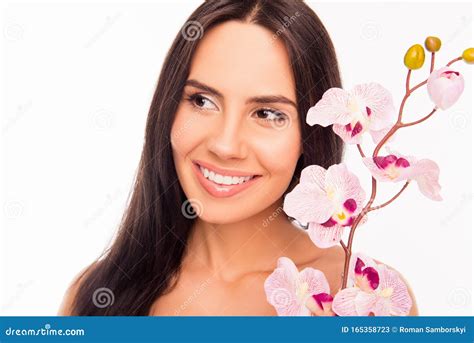 Close Up Photo Of Smiling Brunette Holding Orchid Near Her Face Stock Image Image Of Healthy